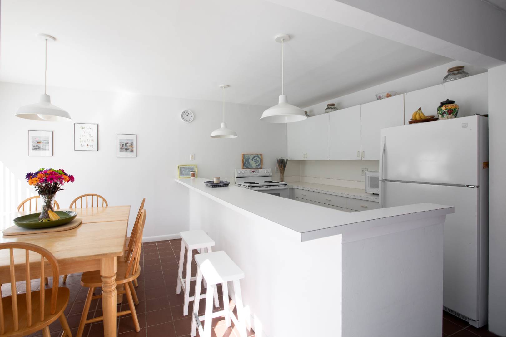 15 North Quarter Road Westhampton, NY 11977 - Photo 9 of 20 a kitchen with a sink a refrigerator and a stove