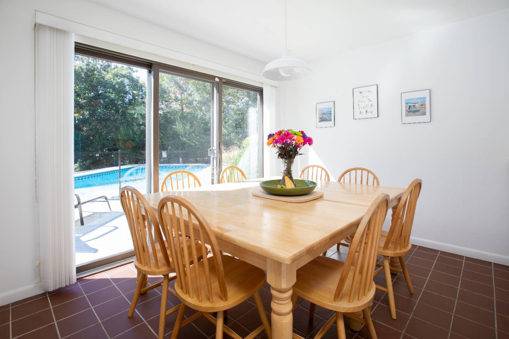 15 North Quarter Road Westhampton, NY 11977 - Photo 10 of 20 a view of a dining room with furniture and a potted plant