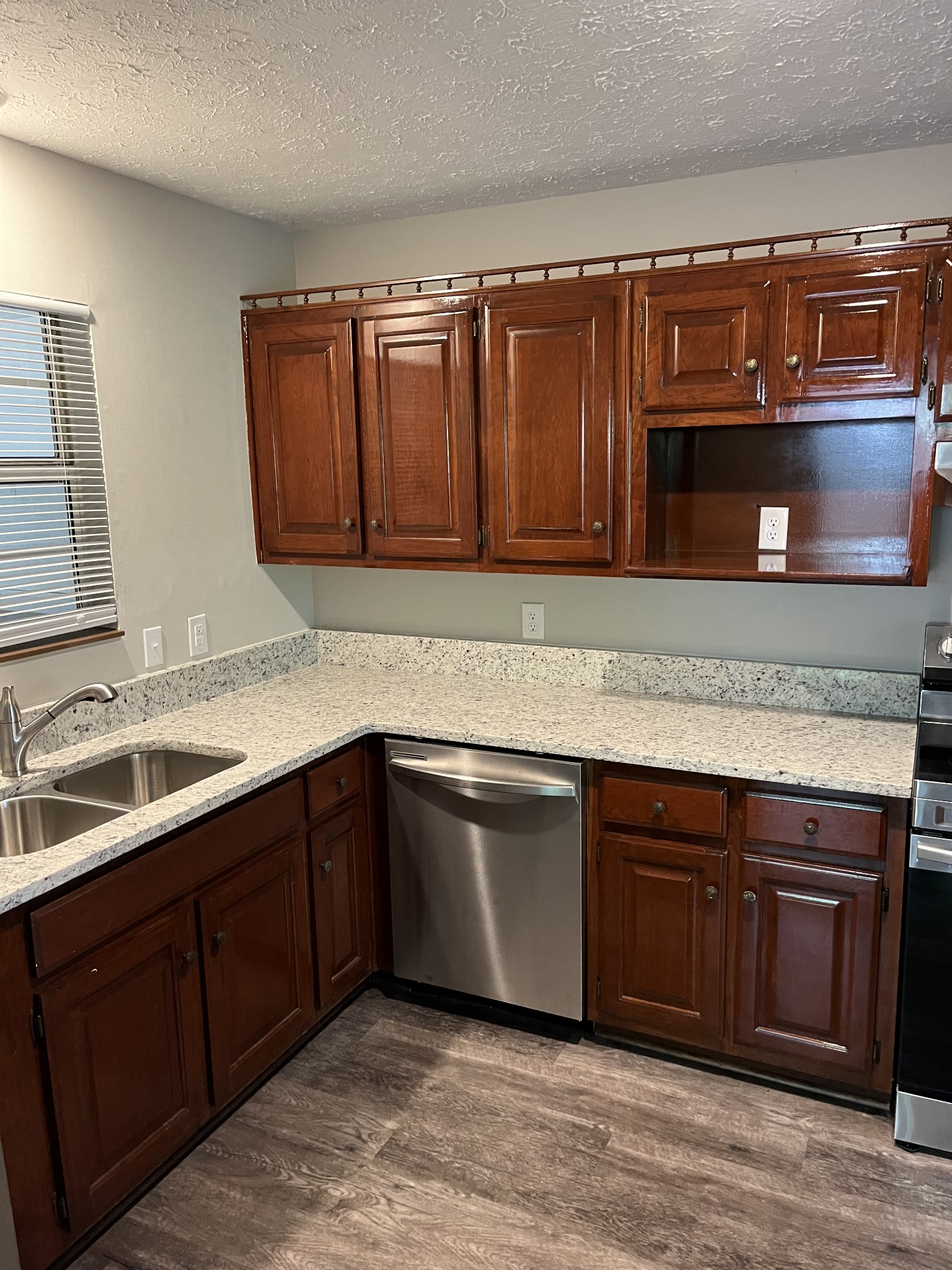 4650 Chicken Road Lebanon, TN 37090 - Photo 31 of 45 a kitchen with granite countertop a sink and a stove top oven