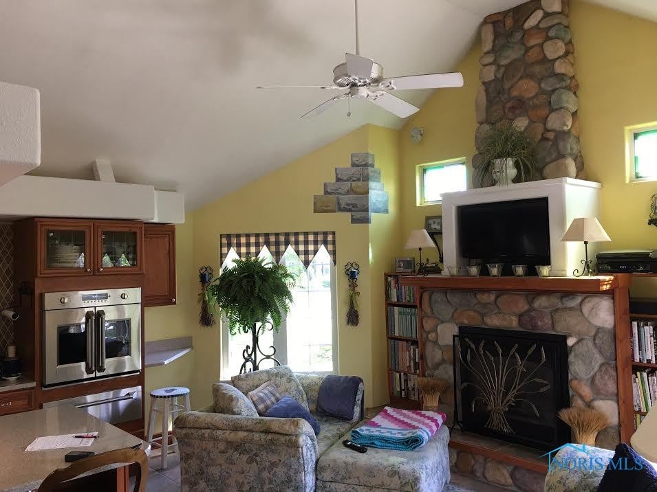 711 Ransom Street Maumee, OH 43537 - Photo 3 of 17 This stone fireplace is the focal point of this family room. Gas insert, television surround, Bose speakers, stained glass windows and 13 foot ceilings and the list goes on.....