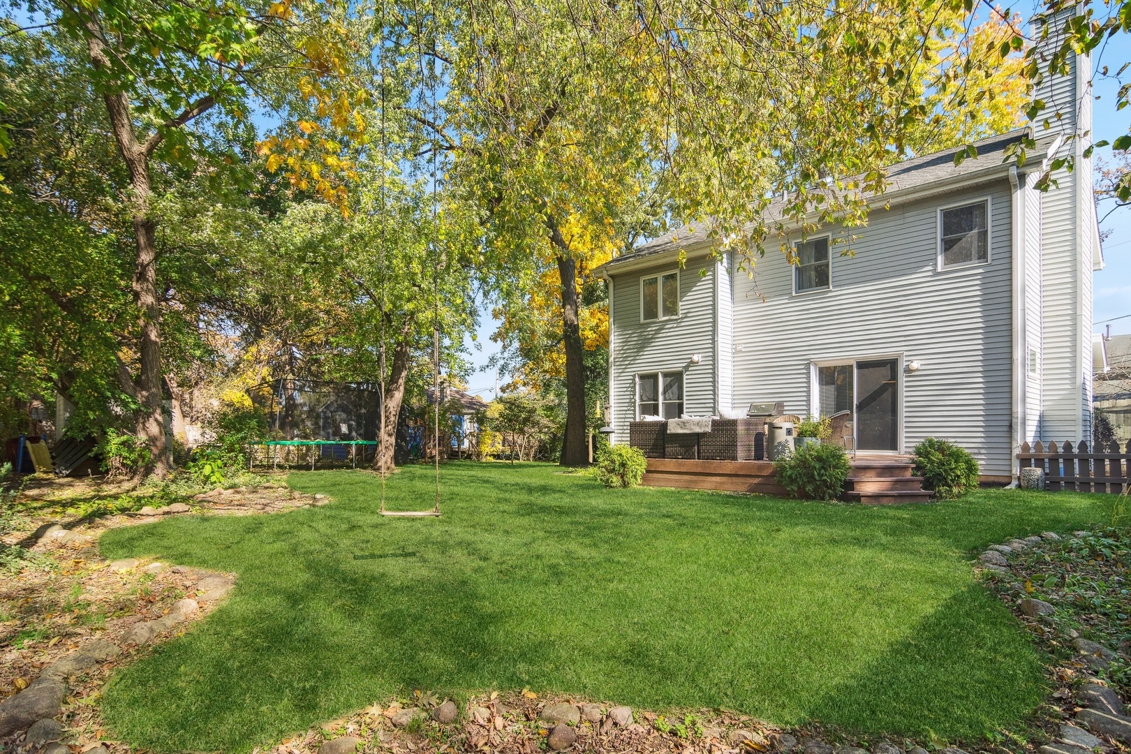8713 Gardner Road Fox River Grove, IL 60021 - Photo 21 of 25 a front view of a house with a garden and trees