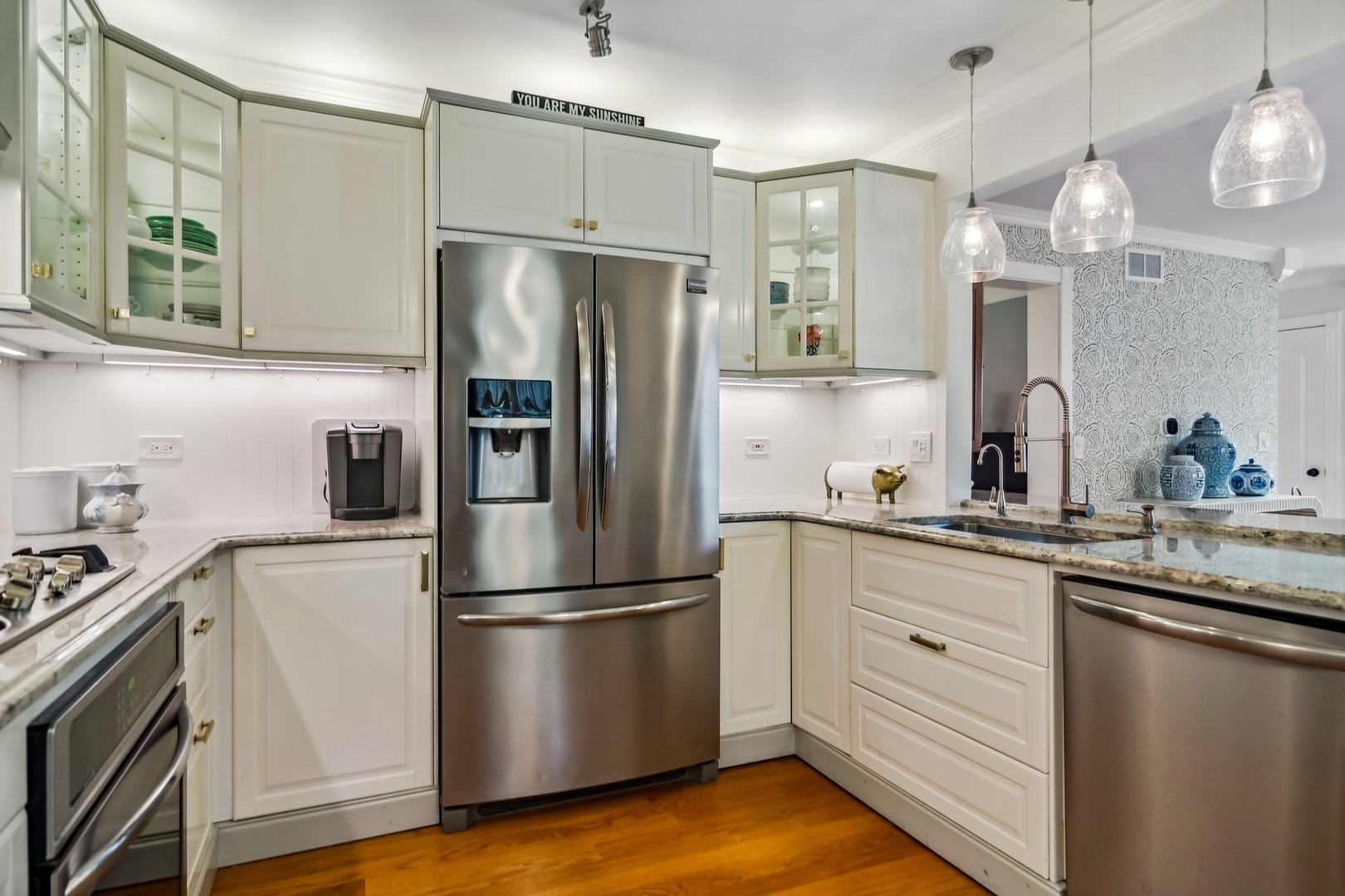 8713 Gardner Road Fox River Grove, IL 60021 - Photo 7 of 25 a kitchen with granite countertop stainless steel appliances a refrigerator a sink and a stove
