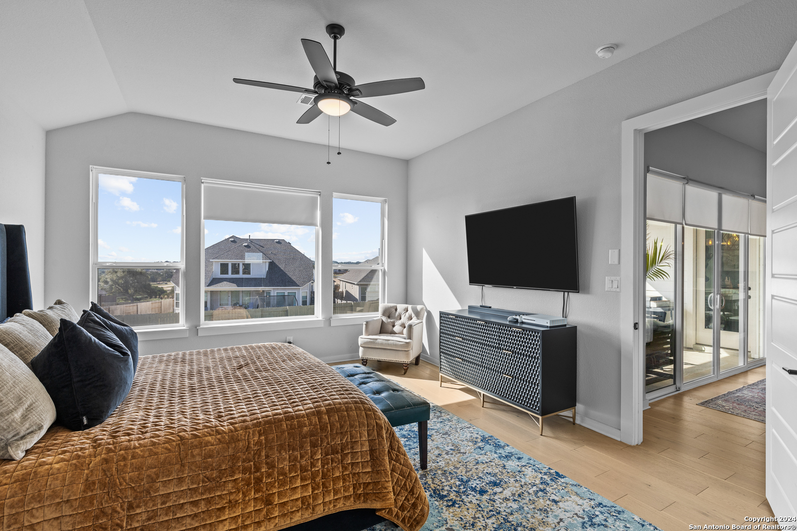 1521 Escarpment Road New Braunfels, TX 78132 - Photo 29 of 65 a bedroom with a bed and a flat screen tv