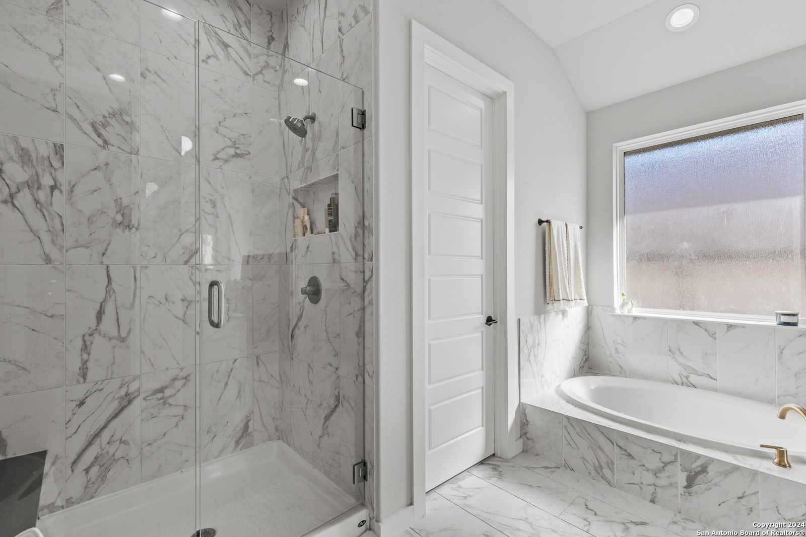 1521 Escarpment Road New Braunfels, TX 78132 - Photo 31 of 65 a bathroom with a bathtub and a shower