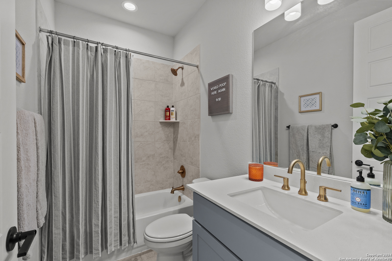 1521 Escarpment Road New Braunfels, TX 78132 - Photo 36 of 65 a bathroom with a granite countertop sink toilet and shower