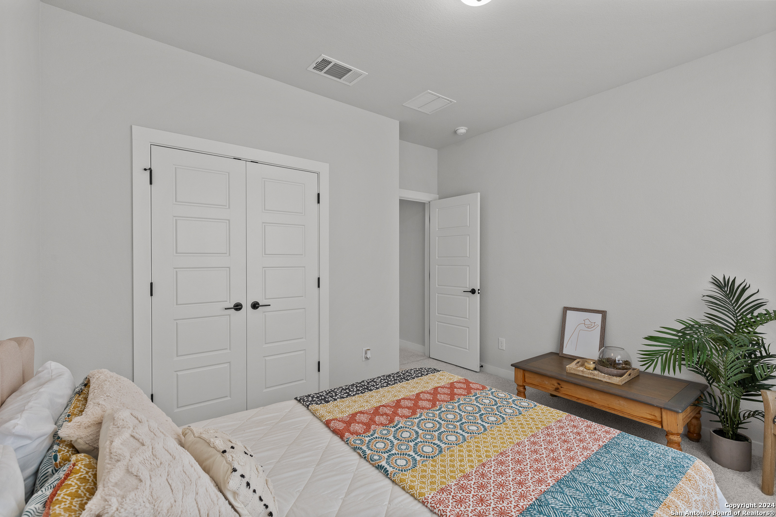 1521 Escarpment Road New Braunfels, TX 78132 - Photo 48 of 65 a bedroom with a bed and a lamp