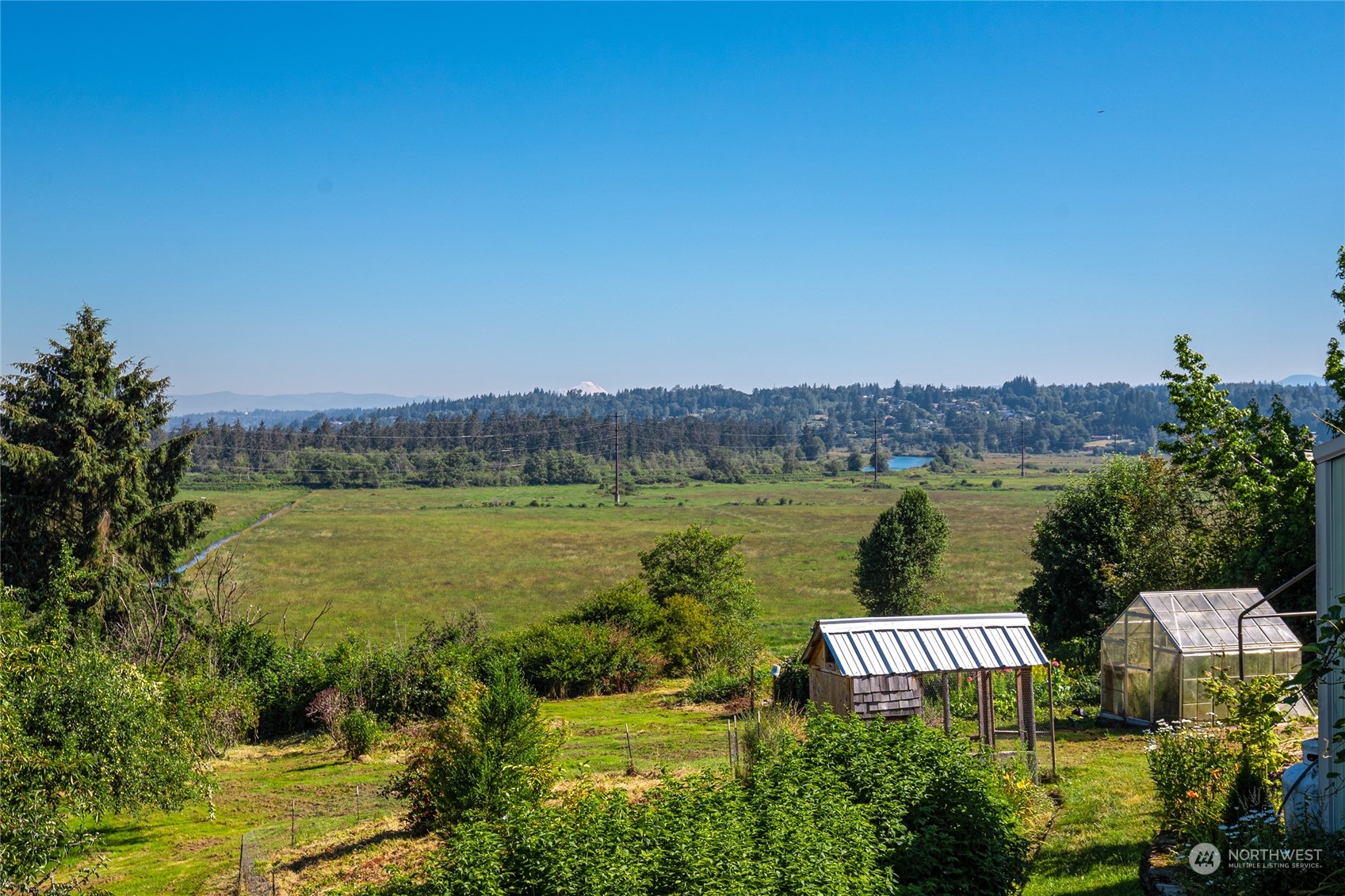 6705 Skipley Road Snohomish, WA 98290 - Photo 19 of 40 a view of a lake with houses in the back
