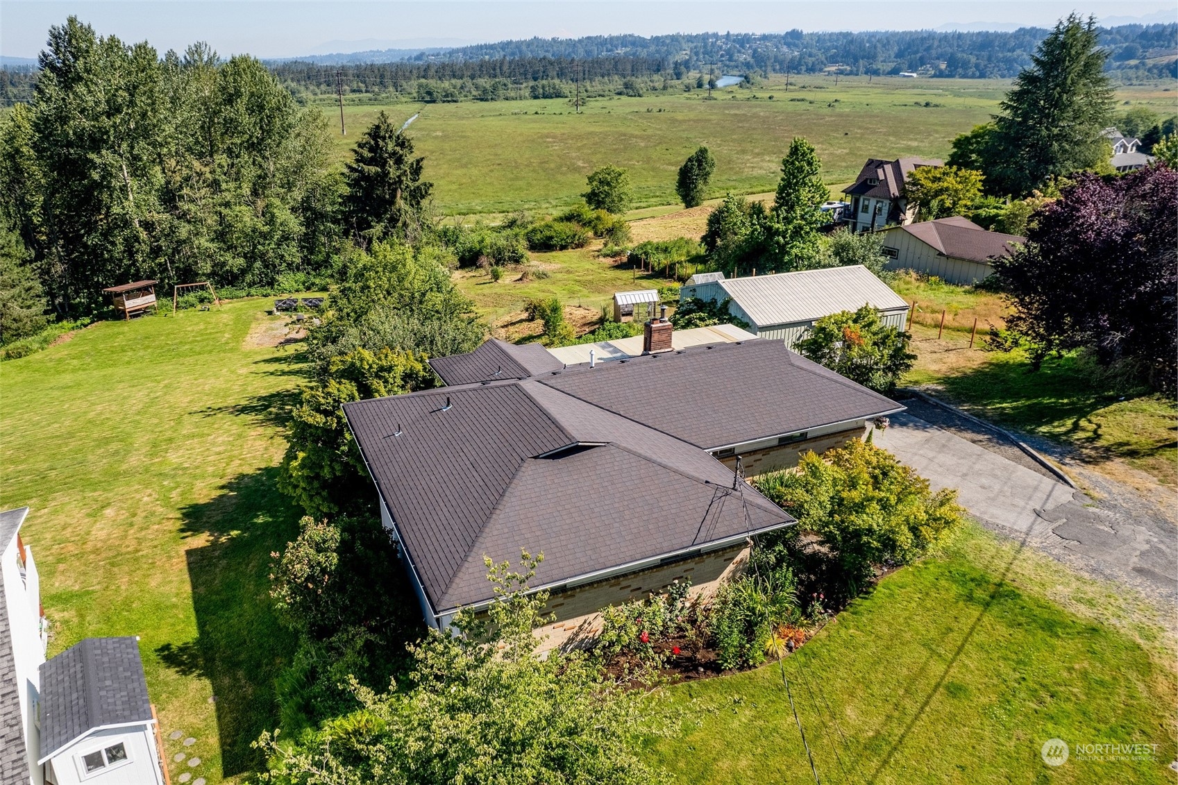 6705 Skipley Road Snohomish, WA 98290 - Photo 2 of 40 a aerial view of a house with outdoor space and lake view