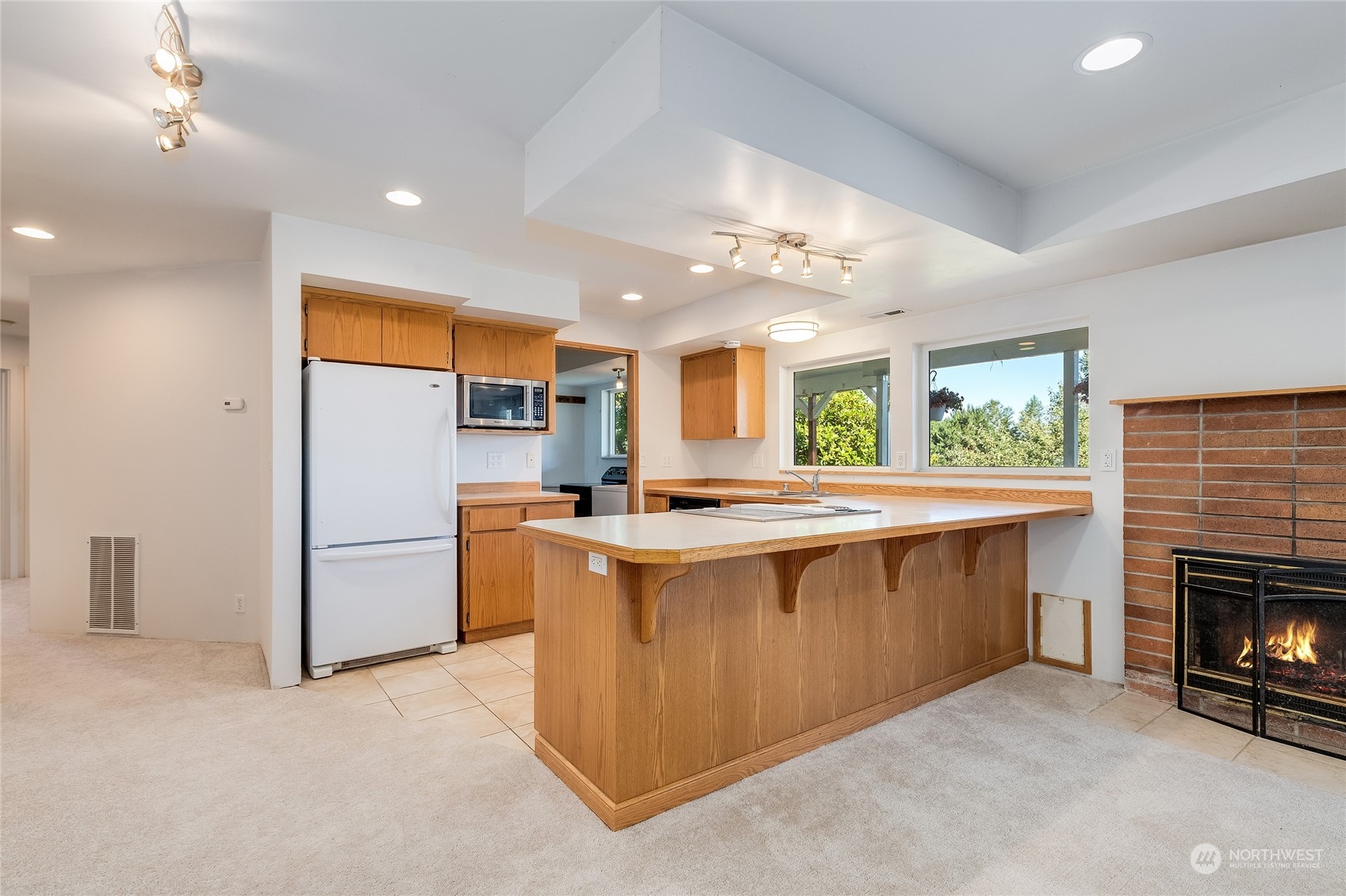 6705 Skipley Road Snohomish, WA 98290 - Photo 23 of 40 a kitchen with stainless steel appliances granite countertop a stove and a refrigerator