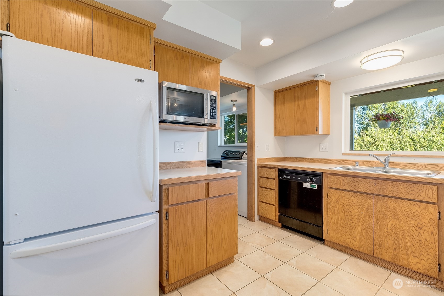 6705 Skipley Road Snohomish, WA 98290 - Photo 25 of 40 a kitchen with stainless steel appliances granite countertop a refrigerator and a stove top oven