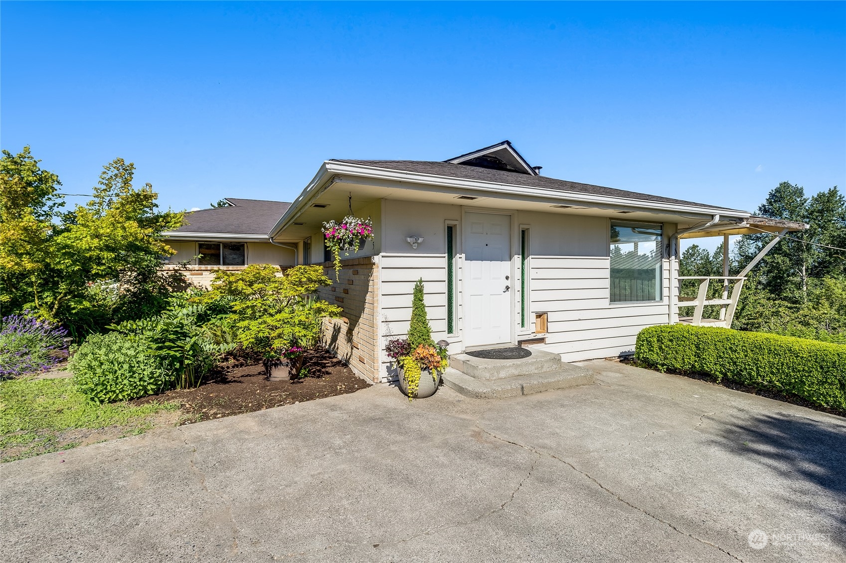 6705 Skipley Road Snohomish, WA 98290 - Photo 3 of 40 a front view of a house with a yard