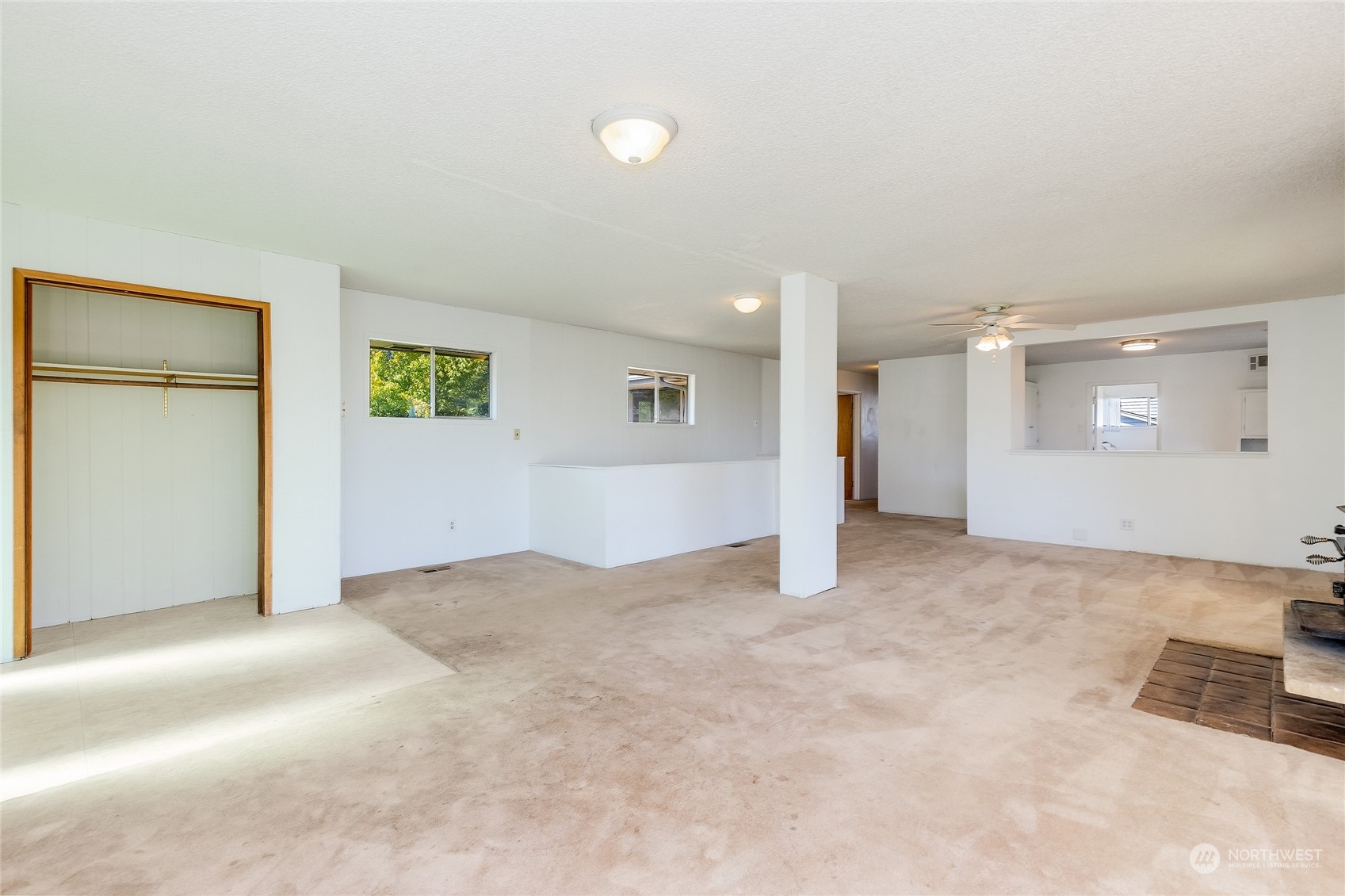 6705 Skipley Road Snohomish, WA 98290 - Photo 6 of 40 an empty room with windows and refrigerator