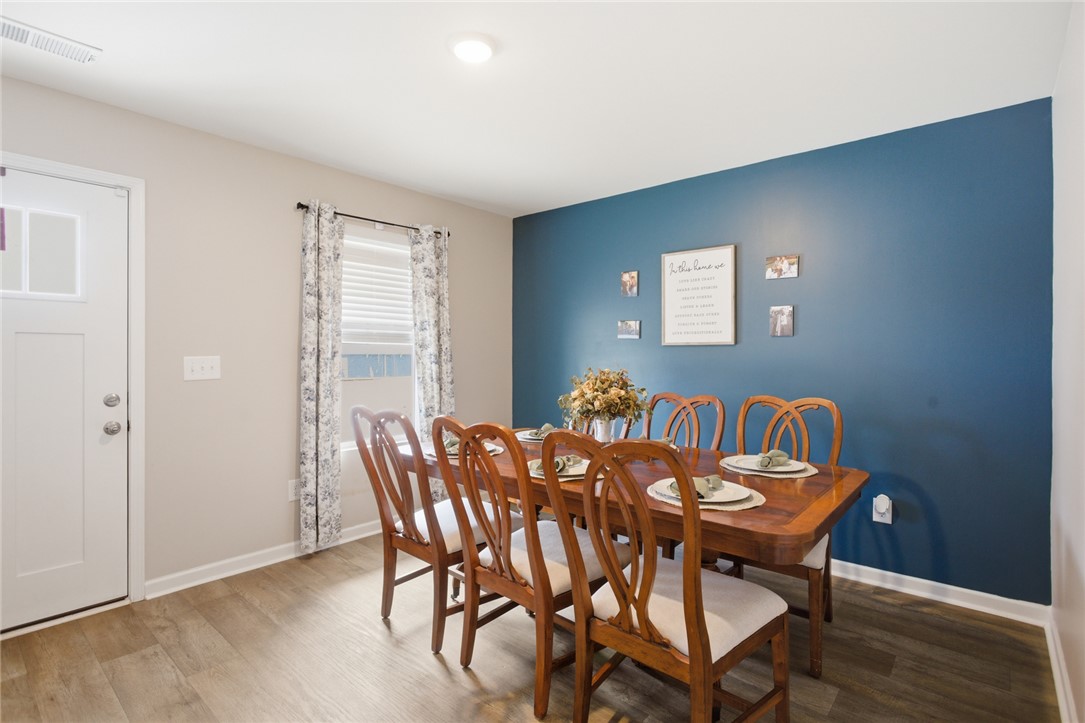1055 South Depot Street Seneca, SC 29678 - Photo 12 of 43 This inviting dining area features a classic dining set, perfect for gatherings.