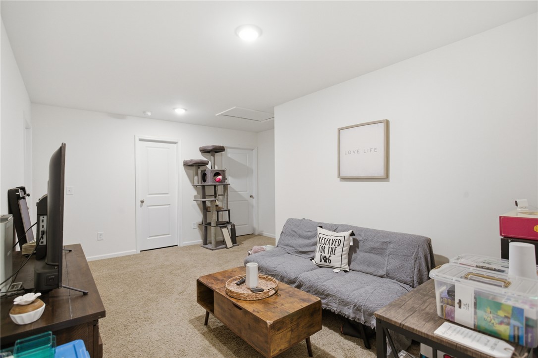 1055 South Depot Street Seneca, SC 29678 - Photo 17 of 43 This versatile living space features warm carpeting and clean white walls, ideal for various uses.