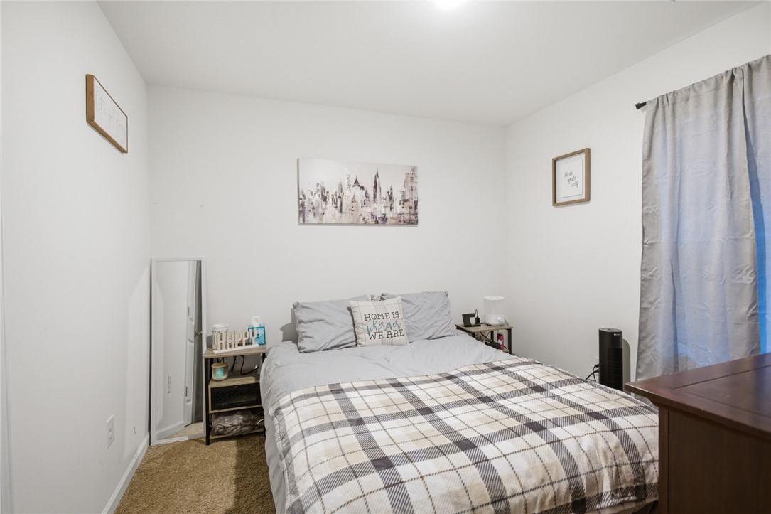 1055 South Depot Street Seneca, SC 29678 - Photo 24 of 43 This cozy bedroom offers a tranquil retreat with soft lighting and ample space for relaxation.
