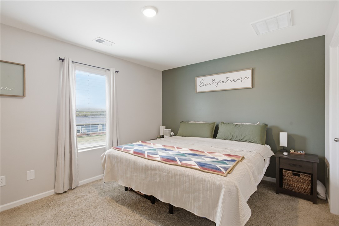 1055 South Depot Street Seneca, SC 29678 - Photo 27 of 43 This cozy bedroom features plush carpeting and a large window providing ample natural light.