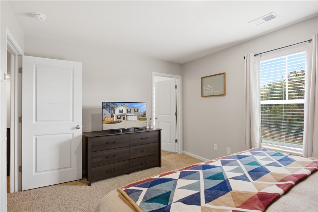 1055 South Depot Street Seneca, SC 29678 - Photo 28 of 43 This cozy bedroom provides a comfortable retreat with ample natural light.