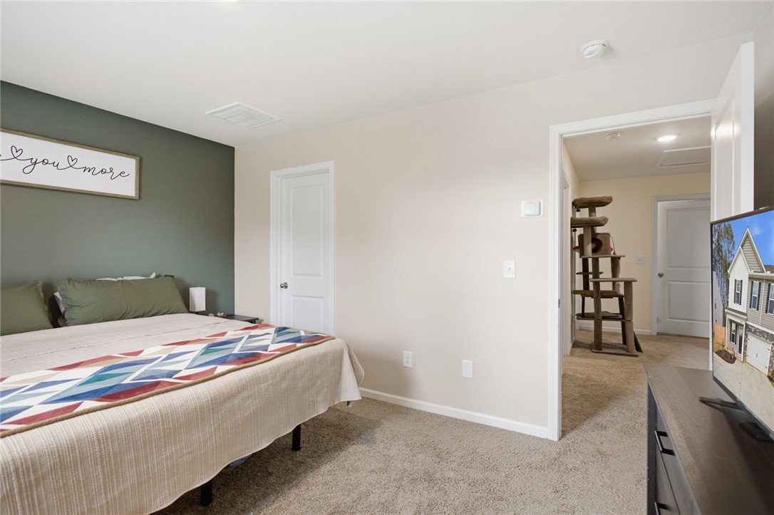 1055 South Depot Street Seneca, SC 29678 - Photo 29 of 43 This spacious bedroom offers a tranquil retreat with soft carpeting and ample natural light.