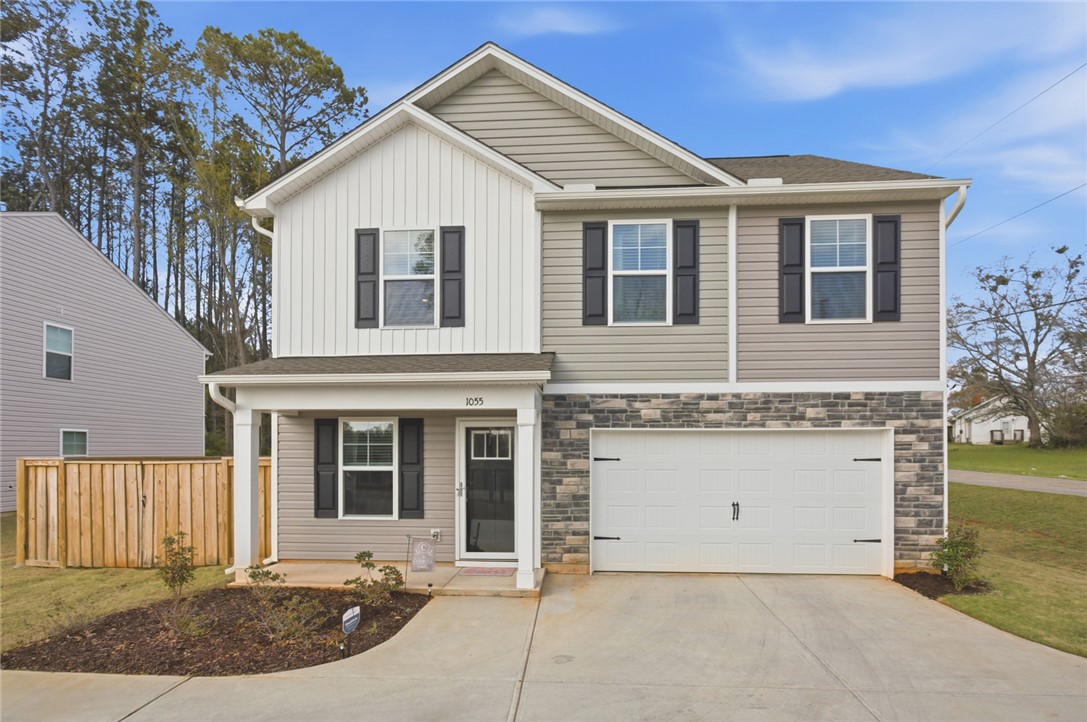 1055 South Depot Street Seneca, SC 29678 - Photo 3 of 43 This newly constructed home features a welcoming facade and convenient attached garage.