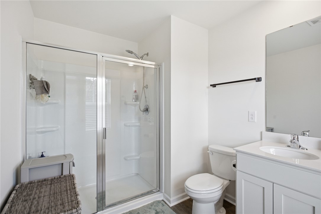 1055 South Depot Street Seneca, SC 29678 - Photo 31 of 43 This clean and bright bathroom features a convenient shower and a modern vanity.