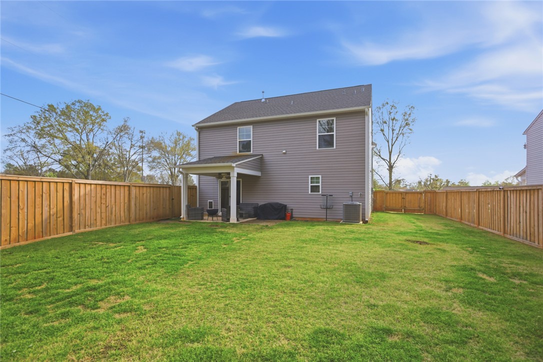 1055 South Depot Street Seneca, SC 29678 - Photo 35 of 43 This private yard offers a spacious lawn and a covered patio perfect for outdoor enjoyment.