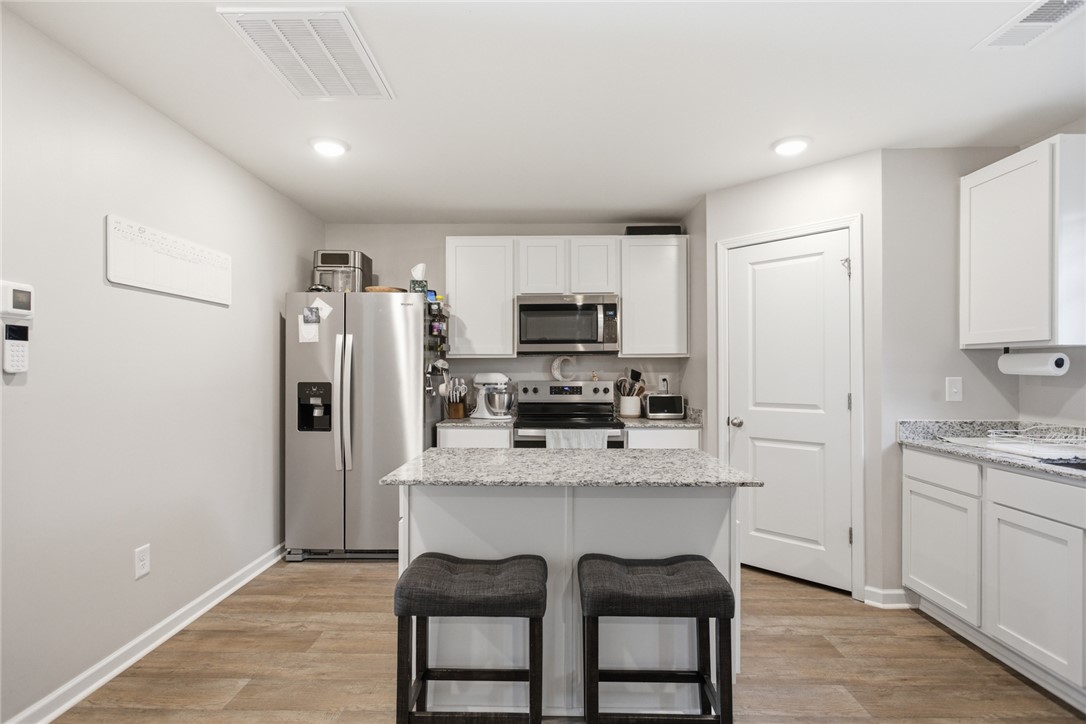 1055 South Depot Street Seneca, SC 29678 - Photo 7 of 43 This bright kitchen features sleek appliances and ample counter space, perfect for everyday living.