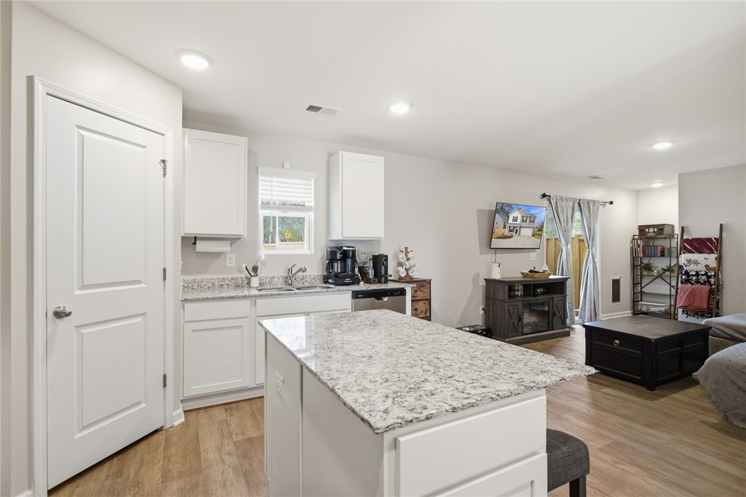 1055 South Depot Street Seneca, SC 29678 - Photo 9 of 43 This open concept kitchen and living space provides seamless flow and modern comfort.