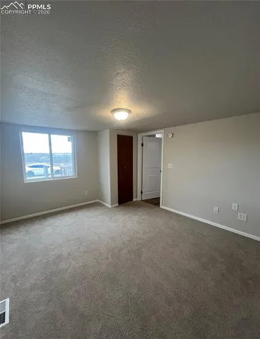 a view of a kitchen with a sink and a stove top oven