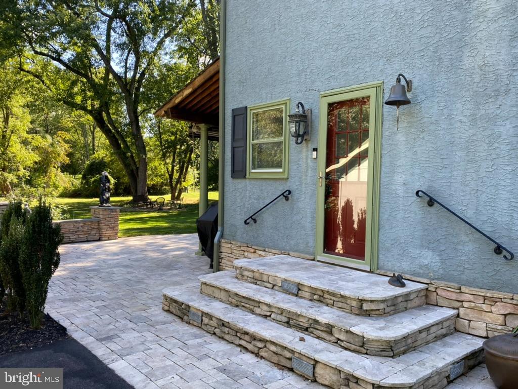 424 Red Coat Lane Wayne, PA 19087 - Photo 10 of 58 Side door with stone stoop - enters into mud room