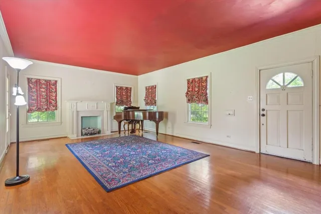 a living room with furniture rug and window