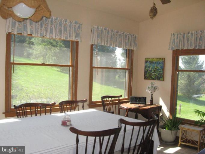 11935 Beaver Dam Road Union Bridge, MD 21791 - Photo 8 of 14 a view of a dining room with furniture window and outside view