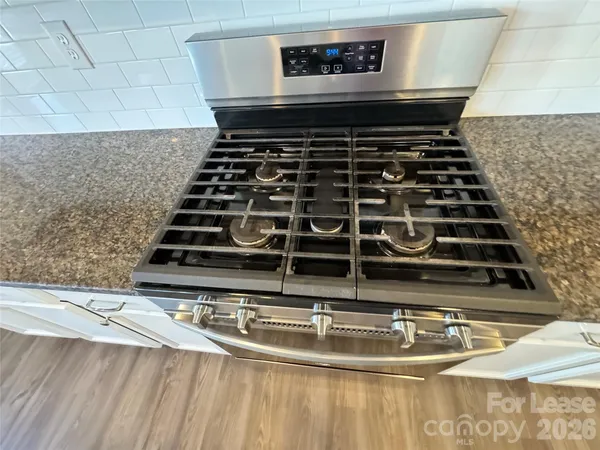 a living room with a fireplace and a flat screen tv