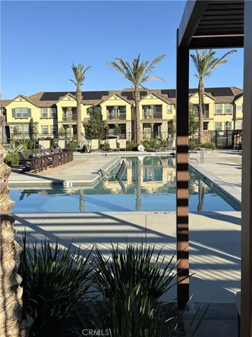 a view of a patio with swimming pool table and chairs