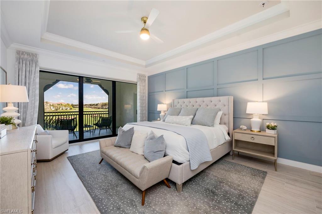 16351 Viansa Way, Unit 202 Naples, FL 34110 - Photo 11 of 35 Bedroom featuring a decorative wall, access to outside, ceiling fan, a raised ceiling, and ornamental molding