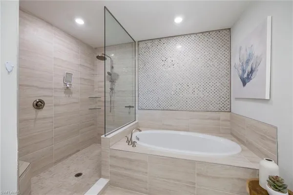 a bathroom with a double vanity sink mirror and