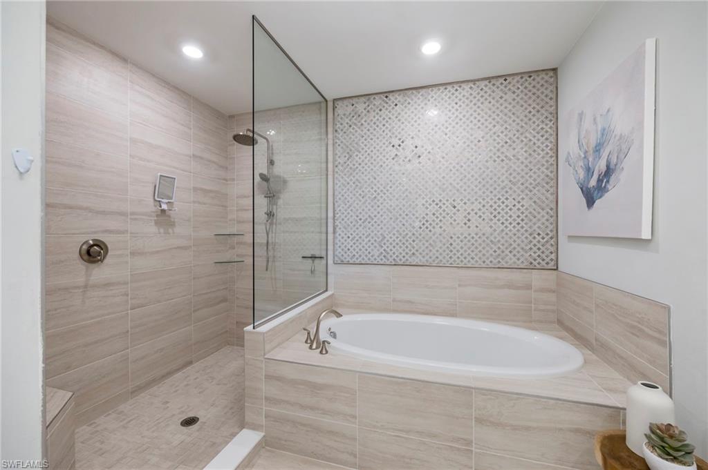 16351 Viansa Way, Unit 202 Naples, FL 34110 - Photo 13 of 35 Full bath with a garden tub and walk in shower