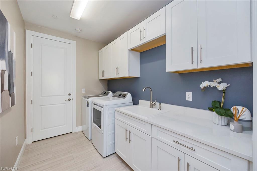 16351 Viansa Way, Unit 202 Naples, FL 34110 - Photo 20 of 35 Laundry area featuring cabinet space and independent washer and dryer