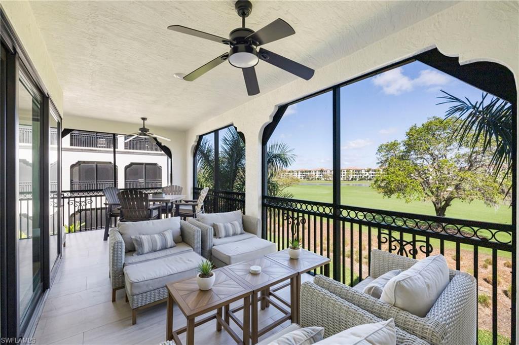 16351 Viansa Way, Unit 202 Naples, FL 34110 - Photo 21 of 35 Sunroom with golf course view, a ceiling fan, and an outdoor living / dining area