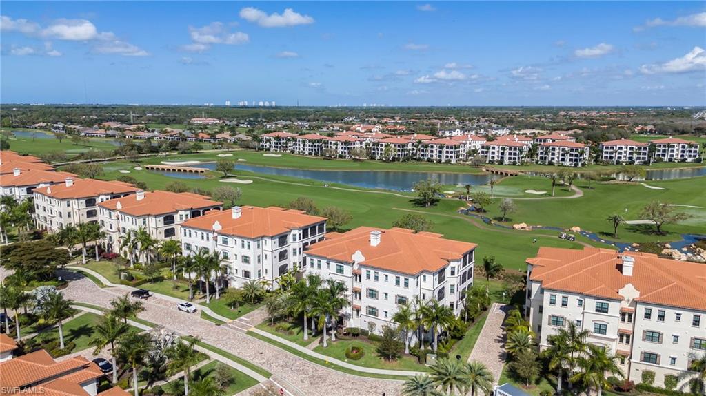 16351 Viansa Way, Unit 202 Naples, FL 34110 - Photo 24 of 35 Drone / aerial view of apartment complex and a local golf course