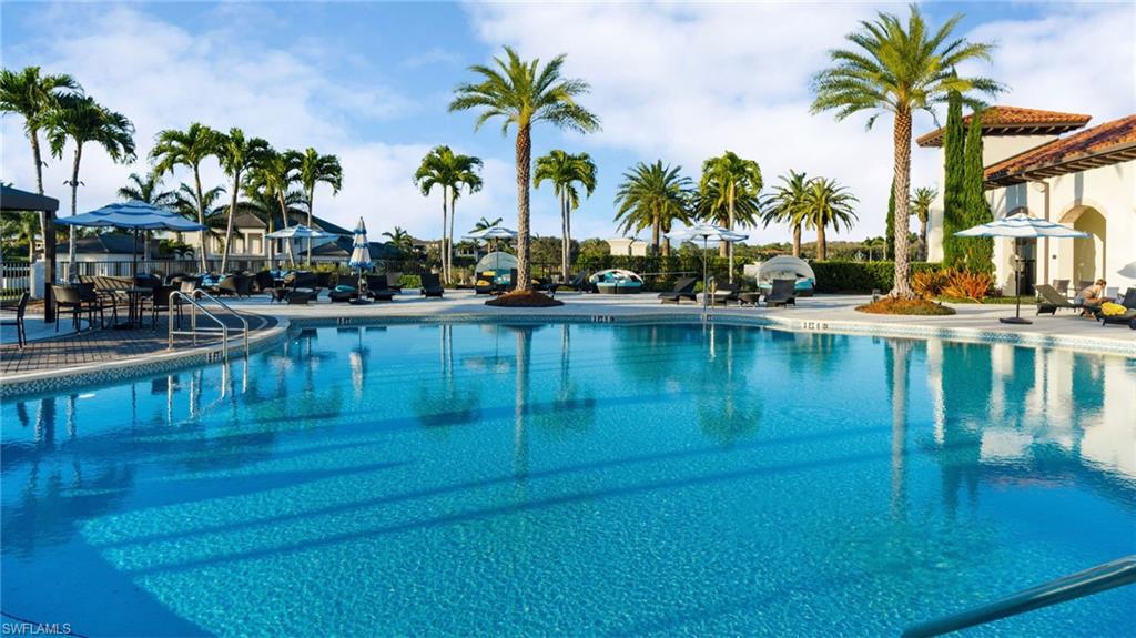 16351 Viansa Way, Unit 202 Naples, FL 34110 - Photo 31 of 35 Community pool featuring a patio