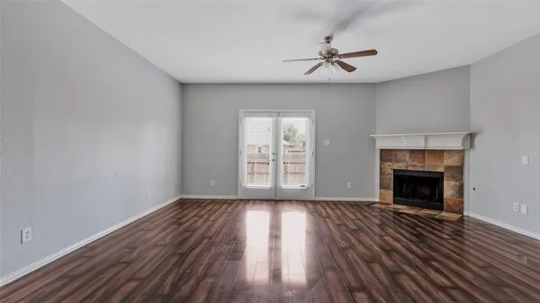a kitchen with stainless steel appliances granite countertop a refrigerator a sink a stove a washer and dryer