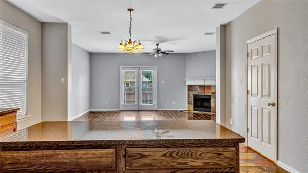 a kitchen with stainless steel appliances granite countertop a sink stove and cabinets