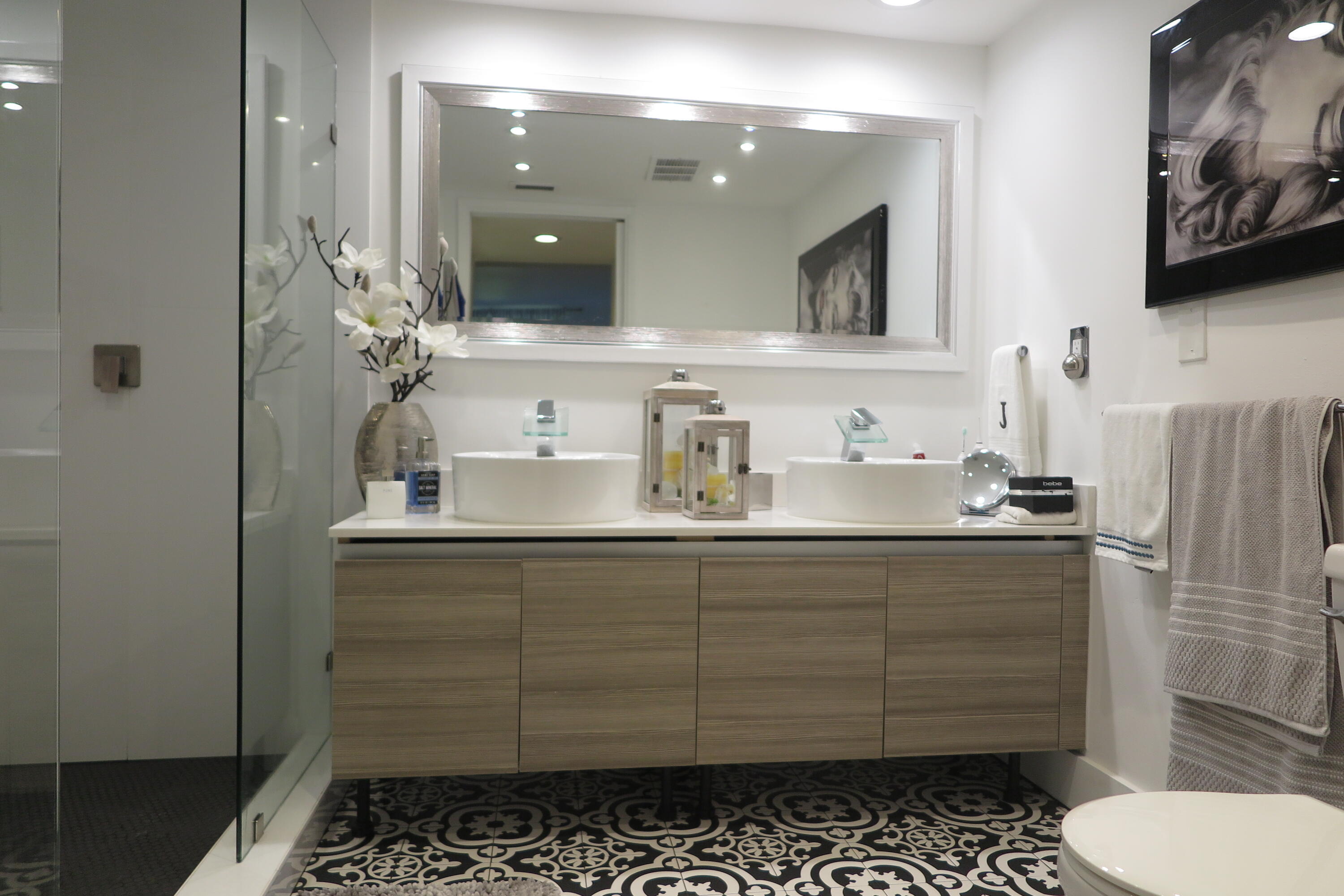 7875 La Mirada Drive Boca Raton, FL 33433 - Photo 16 of 31 a bathroom with a toilet a sink and mirror