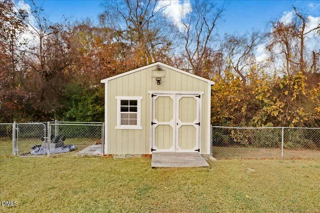 an aerial view of residential house with outdoor space and swimming pool