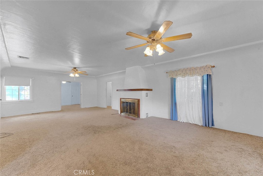 220 East Duarte Road Arcadia, CA 91006 - Photo 10 of 10 a view of a room with a ceiling fan and a window