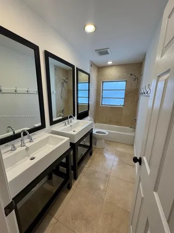 a bathroom with a sink a vanity and a mirror