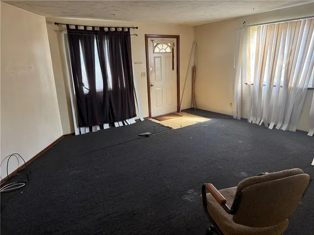 a white toilet sitting next to a bathroom sink and a mirror