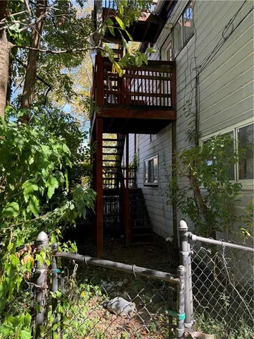 a living room with hard wood floors and a wooden floor