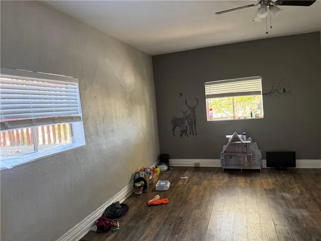 a white toilet sitting next to a sink