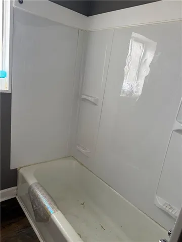 a view of house with deck and wooden floor